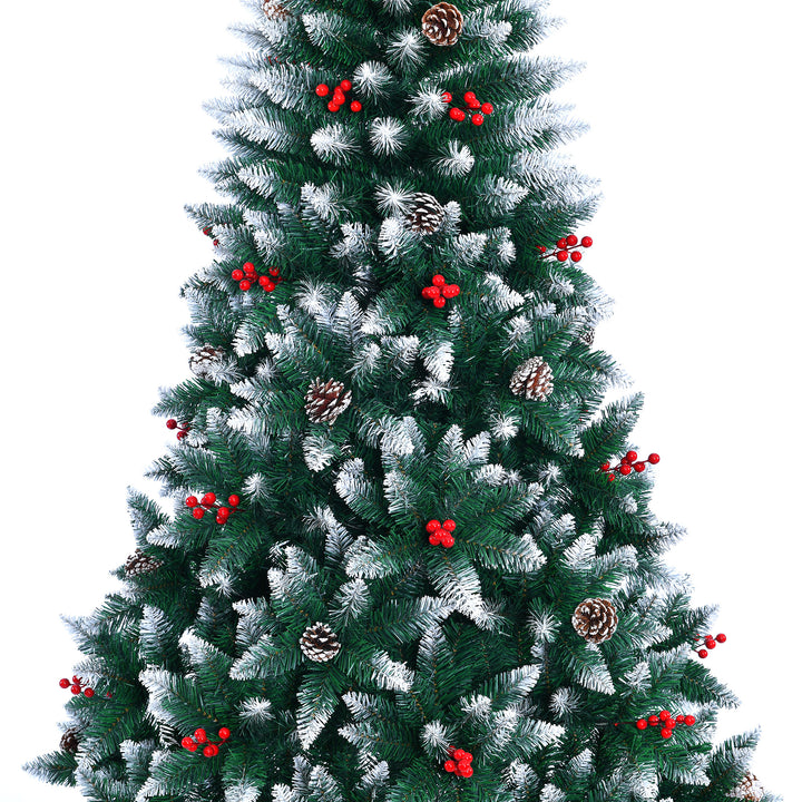 Decorated Christmas tree with red berries and pinecones