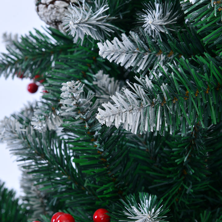Close Up Decorated Christmas tree with red berries and pinecones