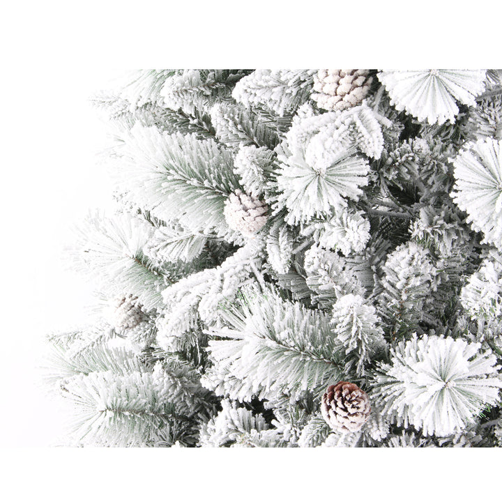 Frosted artificial Christmas tree with pine cones