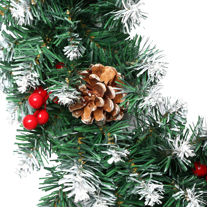 Christmas wreath with pine cones and red berries