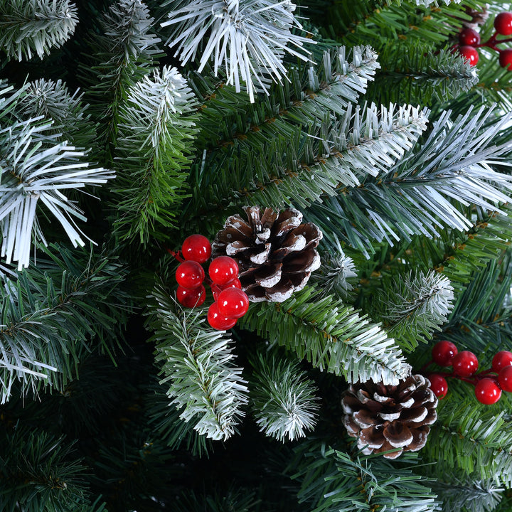 Artificial Christmas tree with green needles, pinecones, and red berries