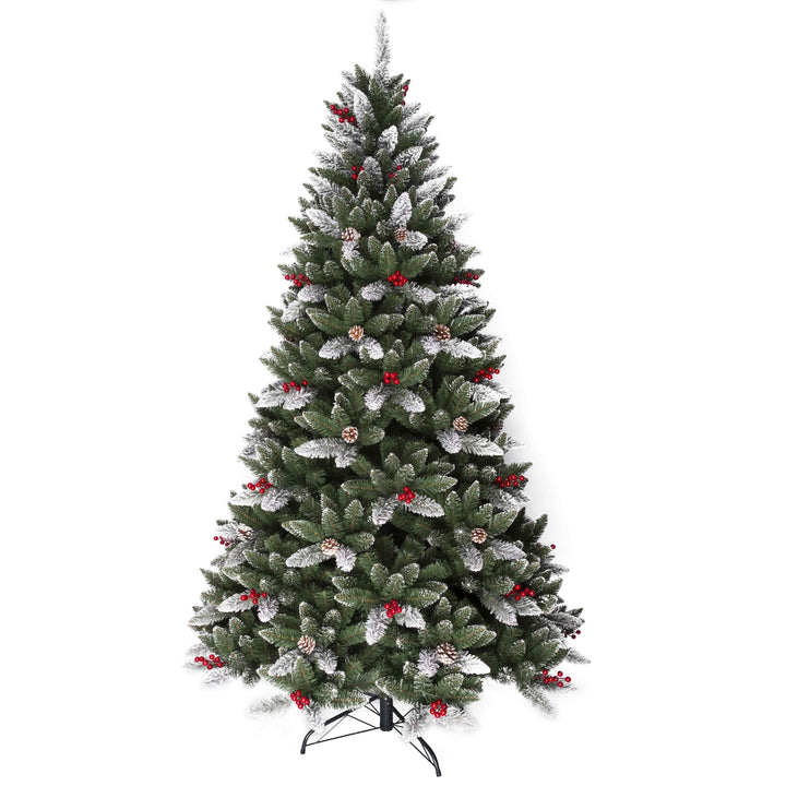 Decorated Christmas tree with artificial snow and red berries