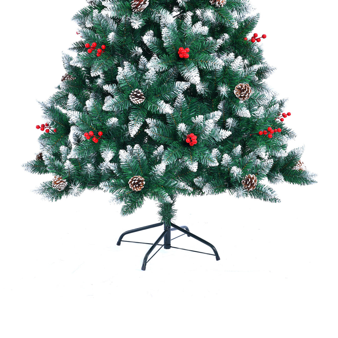 Decorated Christmas tree with red berries and pinecones