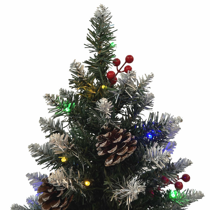 Decorated Christmas tree with lights and pinecones 