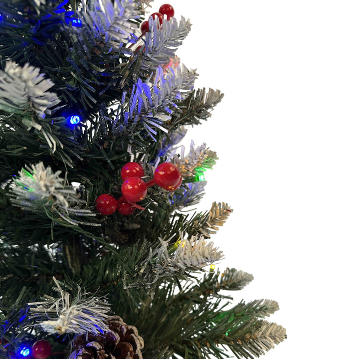 Decorated Christmas tree with lights and pinecones 