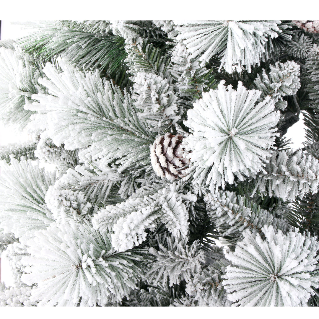 Frosted artificial Christmas tree with pine cones 