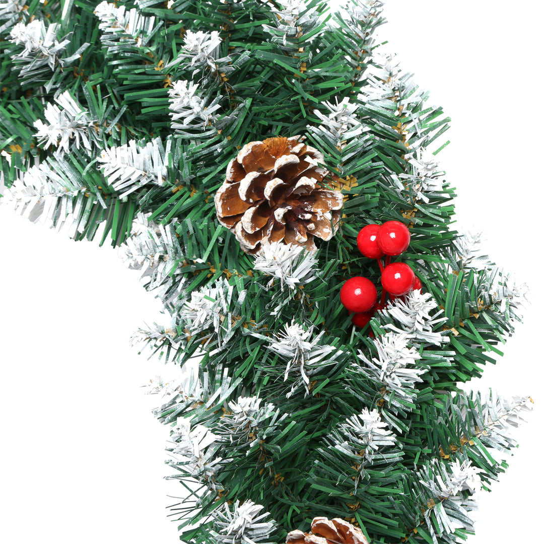 Decorative Christmas garland with pine cones and red berries