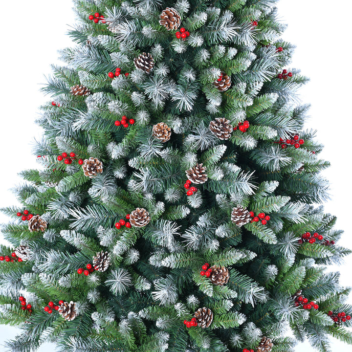Decorated Christmas tree with green needles, red berries, and pinecones 