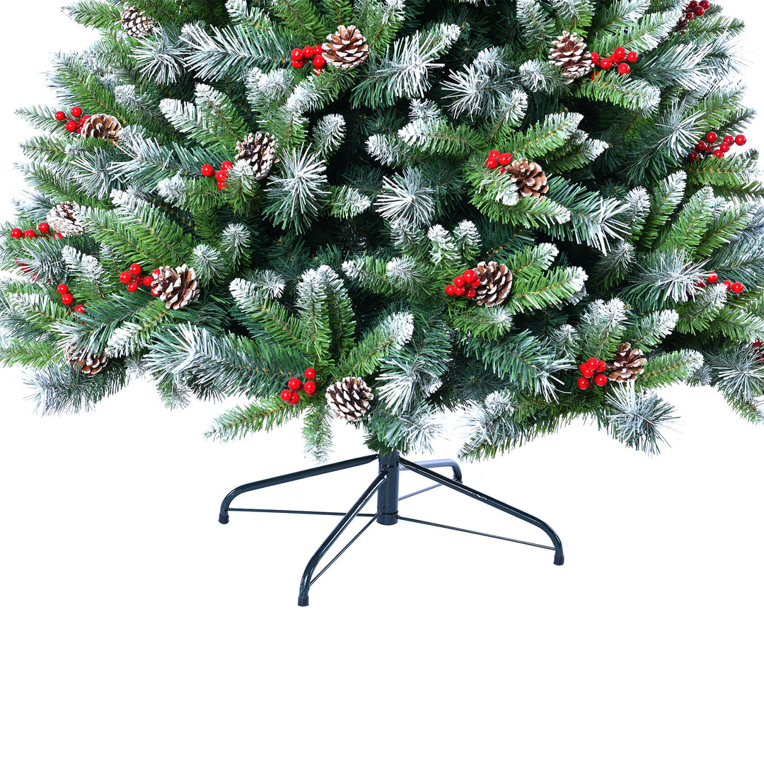 Decorated Christmas tree with green needles, red berries, and pinecones 