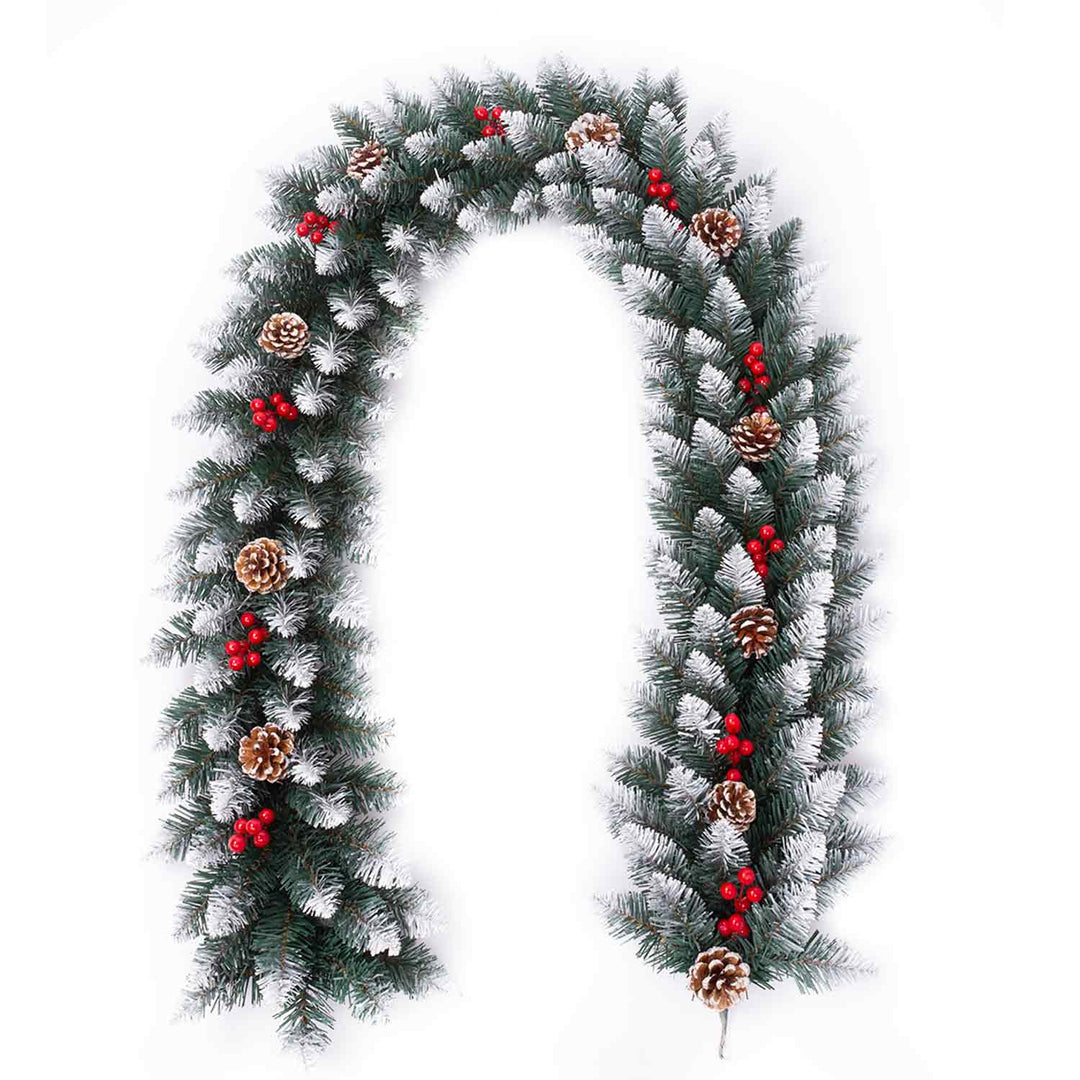 Christmas garland with pine cones and red berries