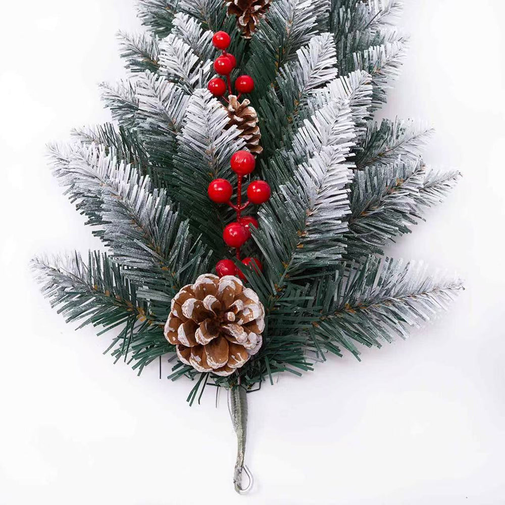 Decorative Christmas garland with pine cones and red berries