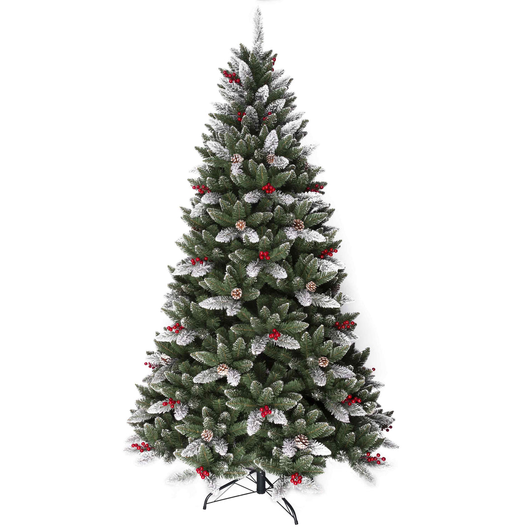 Decorated Christmas tree with artificial snow and red berries