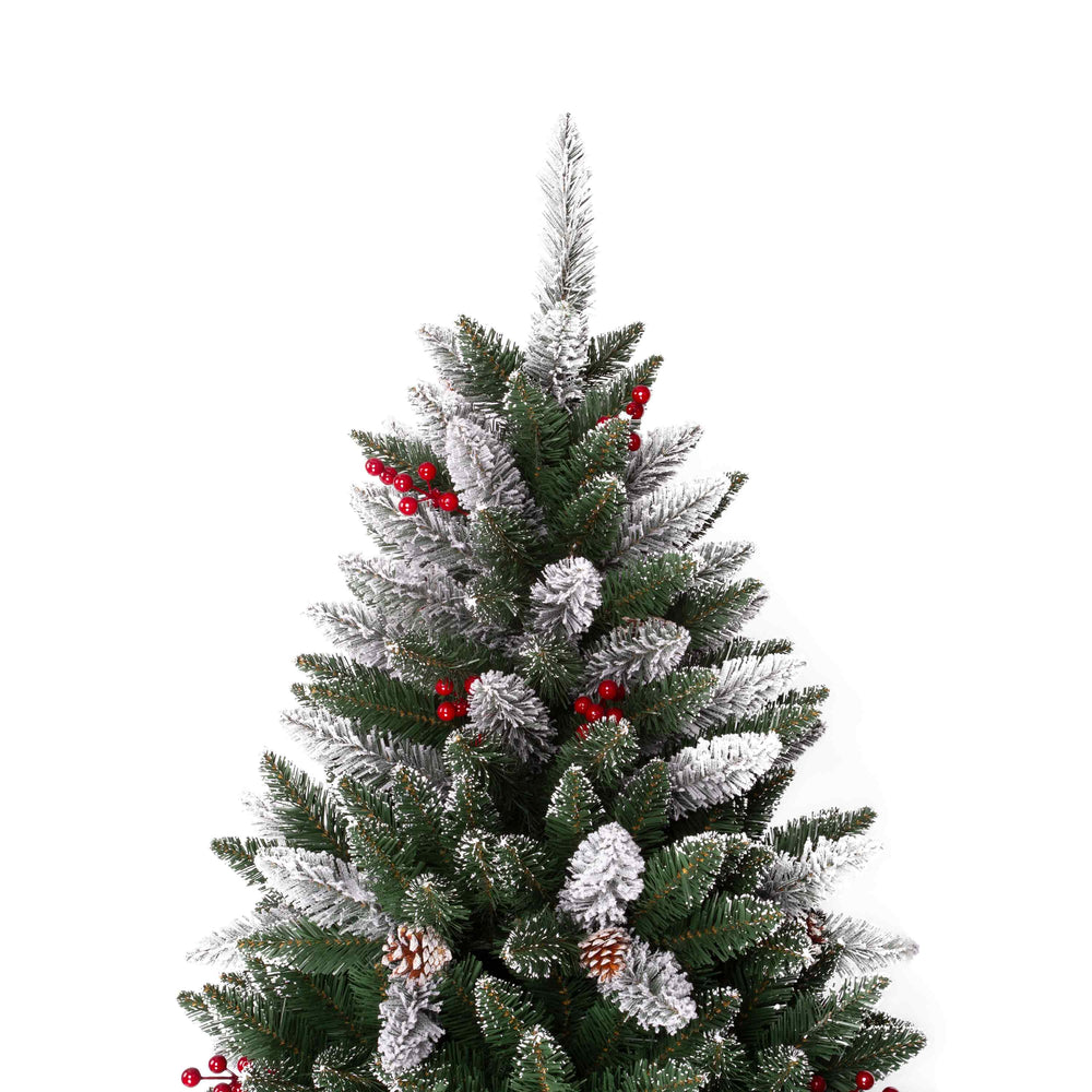 Decorated Christmas tree with red berries and pinecones