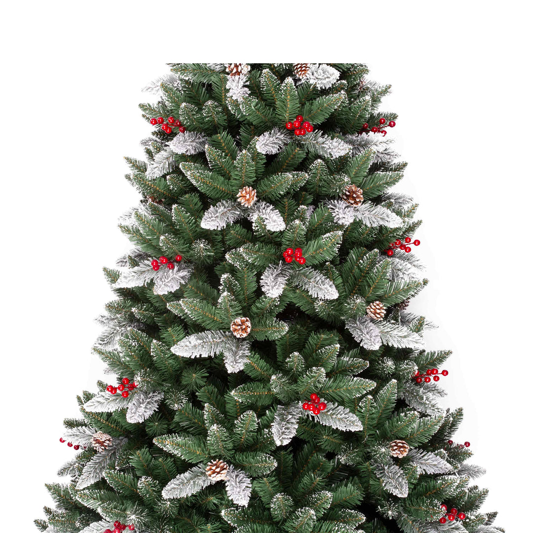 Decorated Christmas tree with red berries and pinecones