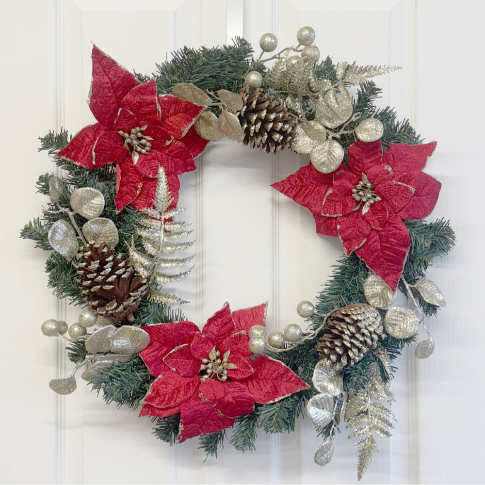 Christmas wreath with red poinsettias