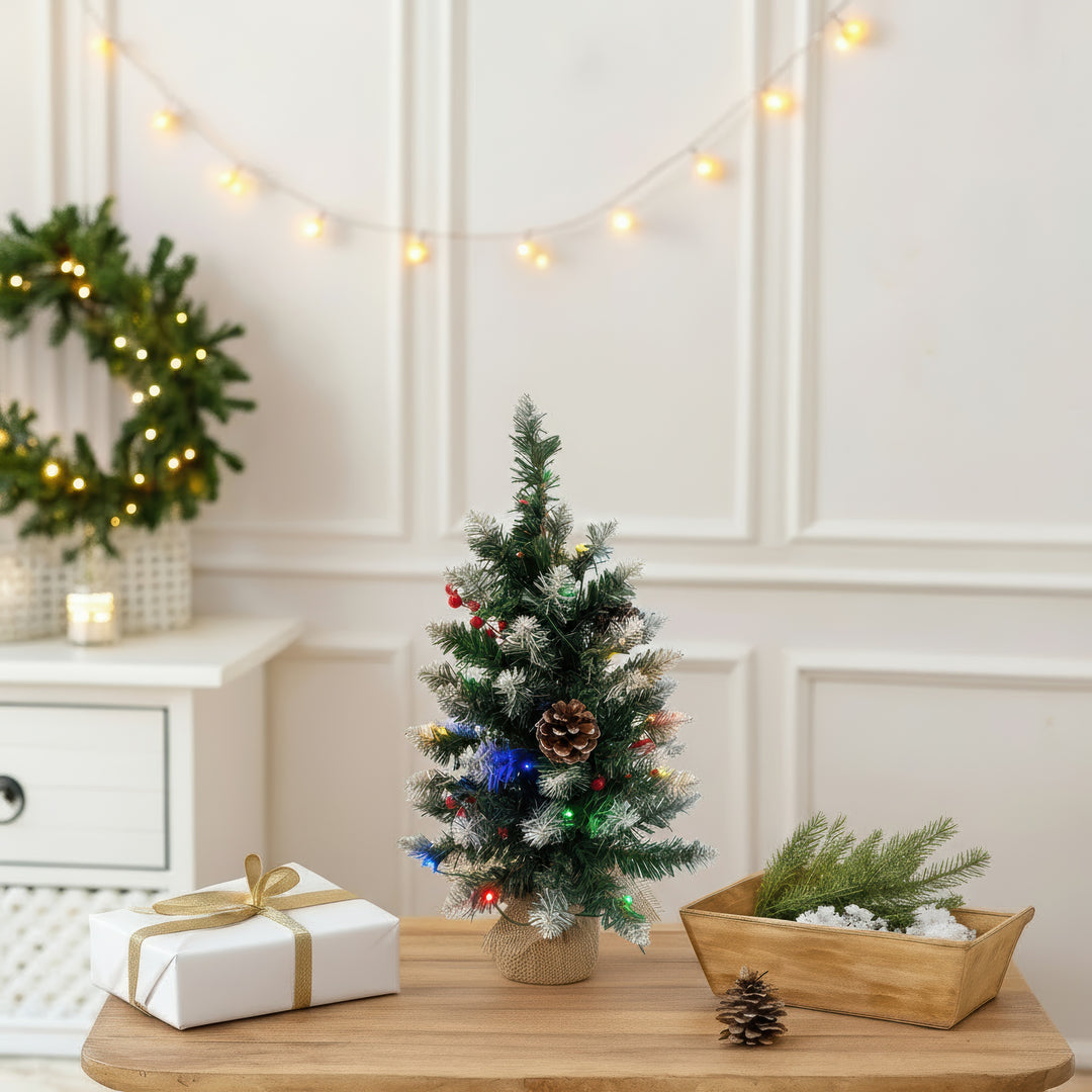 Decorated Christmas tree with lights and pinecones 