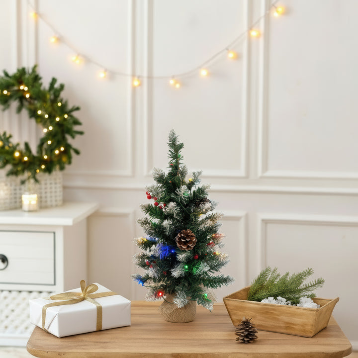 Decorated Christmas tree with lights and pinecones 