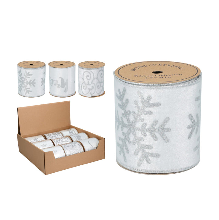 White ribbon with snowflake pattern on spools and a box of white ribbons.