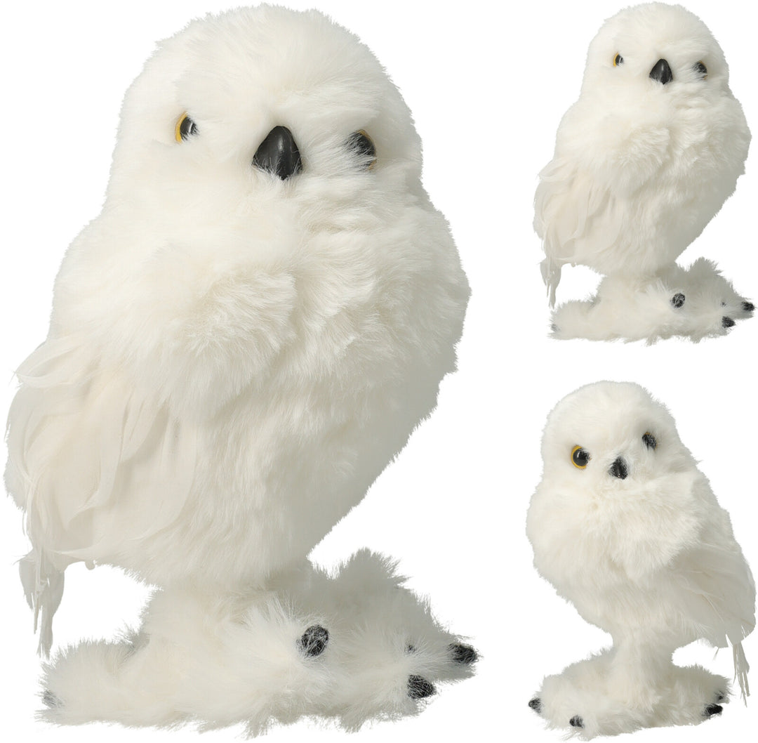 Three white plush owls
