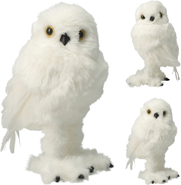 Three white plush owls